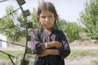 Image of sheet 20030140 photo 7: Mädchen steht vor einem Wasserrad.
Pakistan near Taxila. Girl stands in front  of water mill. 23/05/2003