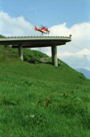 Image of sheet 20030260 photo 30: Göschenen Gotthard Bahntunnel Bahnhof Lokomotive Cargo DHL Wagon Brücke Lastwagen Stau Alis und Raoul Batantu Gordevio mit Rosen Das historische Zollhaus Dazio Grande ist heute Kulturzentrum und Restaurant und Hotel 
Autostrasse oberhalb Motto Bartola Rega Lawinengalerie
Der Gotthardtunnel oder auch Gotthard-Scheiteltunnel ist der Scheiteltunnel der Gotthardbahn und verläuft unter dem Sankt-Gotthard-Pass durch das Schweizer Gotthardmassiv. Der 15 003 Meter lange Eisenbahntunnel besteht aus einer einzelnen, doppelgleisig ausgebauten Tunnelröhre zwischen den Ortschaften Göschenen im Kanton Uri und Airolo im Kanton Tessin.