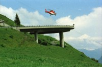 Image of sheet 20030260 photo 31: Göschenen Gotthard Bahntunnel Bahnhof Lokomotive Cargo DHL Wagon Brücke Lastwagen Stau Alis und Raoul Batantu Gordevio mit Rosen Das historische Zollhaus Dazio Grande ist heute Kulturzentrum und Restaurant und Hotel 
Autostrasse oberhalb Motto Bartola Rega Lawinengalerie
Der Gotthardtunnel oder auch Gotthard-Scheiteltunnel ist der Scheiteltunnel der Gotthardbahn und verläuft unter dem Sankt-Gotthard-Pass durch das Schweizer Gotthardmassiv. Der 15 003 Meter lange Eisenbahntunnel besteht aus einer einzelnen, doppelgleisig ausgebauten Tunnelröhre zwischen den Ortschaften Göschenen im Kanton Uri und Airolo im Kanton Tessin.
