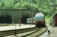 Image of sheet 20030260 photo 7: Göschenen Gotthard Bahntunnel Bahnhof Lokomotive Cargo DHL Wagon Brücke Lastwagen Stau Alis und Raoul Batantu Gordevio mit Rosen Das historische Zollhaus Dazio Grande ist heute Kulturzentrum und Restaurant und Hotel 
Autostrasse oberhalb Motto Bartola Rega Lawinengalerie
Der Gotthardtunnel oder auch Gotthard-Scheiteltunnel ist der Scheiteltunnel der Gotthardbahn und verläuft unter dem Sankt-Gotthard-Pass durch das Schweizer Gotthardmassiv. Der 15 003 Meter lange Eisenbahntunnel besteht aus einer einzelnen, doppelgleisig ausgebauten Tunnelröhre zwischen den Ortschaften Göschenen im Kanton Uri und Airolo im Kanton Tessin.