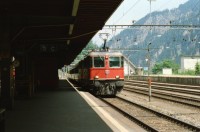 Image of sheet 20030270 photo 15: Göschenen Gotthard Bahntunnel Bahnhof Lokomotive Brücke Lastwagen Stau 
Autostrasse oberhalb Motto Bartola Rega Lawinengalerie Unfall  Tremola Stau Kurve Nationalstrasse 
Der Gotthardtunnel oder auch Gotthard-Scheiteltunnel ist der Scheiteltunnel der Gotthardbahn und verläuft unter dem Sankt-Gotthard-Pass durch das Schweizer Gotthardmassiv. Der 15 003 Meter lange Eisenbahntunnel besteht aus einer einzelnen, doppelgleisig ausgebauten Tunnelröhre zwischen den Ortschaften Göschenen im Kanton Uri und Airolo im Kanton Tessin.
