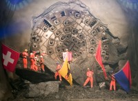 Image of sheet 20110323 photo 546: Miners celebrate after the tunnel drilling machine "Heidi" breaks through the last section of the Gotthard Base Tunnel West near Sedrun in the canton of Grisons, Switzerland, Wednesday, March 23, 2011.
..Die Mineure feiern nach dem 2. Hauptdurchschlag im Gotthardbasistunnel in Sedrun, vor der Tunnelbohrmaschine "Heidi" Mittwoch, 23. Maerz 2011. Wie geplant sind am Mittwoch die letzten Meter Fels im Gotthard-Basistunnel durchstossen worden. Rund fuenf Monate nach dem Durchschlag der Ostroehre ist damit auch die Westroehre zwischen Erstfeld und Bodio auf der gesamten Laenge von 57 Kilometern ausgebrochen. Kanton Graubünden √