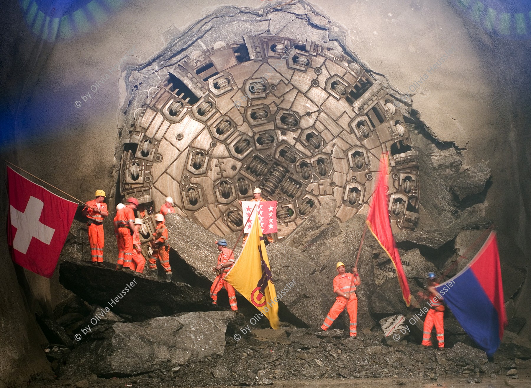 Image of sheet 20110323 photo 546: Miners celebrate after the tunnel drilling machine "Heidi" breaks through the last section of the Gotthard Base Tunnel West near Sedrun in the canton of Grisons, Switzerland, Wednesday, March 23, 2011.
..Die Mineure feiern nach dem 2. Hauptdurchschlag im Gotthardbasistunnel in Sedrun, vor der Tunnelbohrmaschine "Heidi" Mittwoch, 23. Maerz 2011. Wie geplant sind am Mittwoch die letzten Meter Fels im Gotthard-Basistunnel durchstossen worden. Rund fuenf Monate nach dem Durchschlag der Ostroehre ist damit auch die Westroehre zwischen Erstfeld und Bodio auf der gesamten Laenge von 57 Kilometern ausgebrochen. Kanton Graubünden √