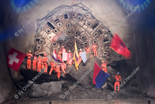 Image of sheet 20110323 photo 548: Miners celebrate after the tunnel drilling machine "Heidi" breaks through the last section of the Gotthard Base Tunnel West near Sedrun in the canton of Grisons, Switzerland, Wednesday, March 23, 2011.
..Die Mineure feiern nach dem 2. Hauptdurchschlag im Gotthardbasistunnel in Sedrun, vor der Tunnelbohrmaschine "Heidi" Mittwoch, 23. Maerz 2011. Wie geplant sind am Mittwoch die letzten Meter Fels im Gotthard-Basistunnel durchstossen worden. Rund fuenf Monate nach dem Durchschlag der Ostroehre ist damit auch die Westroehre zwischen Erstfeld und Bodio auf der gesamten Laenge von 57 Kilometern ausgebrochen. Kanton Graubünden √