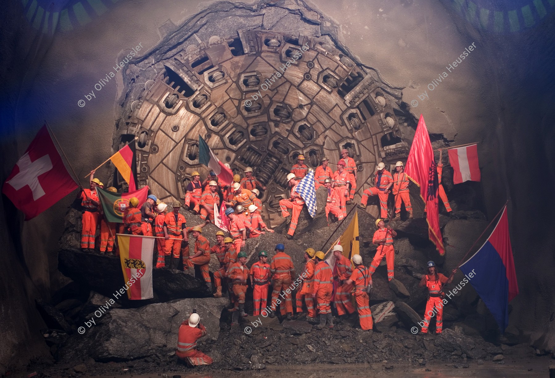 Image of sheet 20110323 photo 551: Miners celebrate after the tunnel drilling machine "Heidi" breaks through the last section of the Gotthard Base Tunnel West near Sedrun in the canton of Grisons, Switzerland, Wednesday, March 23, 2011.
..Die Mineure feiern nach dem 2. Hauptdurchschlag im Gotthardbasistunnel in Sedrun, vor der Tunnelbohrmaschine "Heidi" Mittwoch, 23. Maerz 2011. Wie geplant sind am Mittwoch die letzten Meter Fels im Gotthard-Basistunnel durchstossen worden. Rund fuenf Monate nach dem Durchschlag der Ostroehre ist damit auch die Westroehre zwischen Erstfeld und Bodio auf der gesamten Laenge von 57 Kilometern ausgebrochen. Kanton Graubünden √