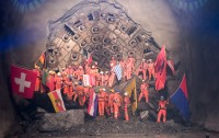 Image of sheet 20110323 photo 552: Miners celebrate after the tunnel drilling machine "Heidi" breaks through the last section of the Gotthard Base Tunnel West near Sedrun in the canton of Grisons, Switzerland, Wednesday, March 23, 2011.
..Die Mineure feiern nach dem 2. Hauptdurchschlag im Gotthardbasistunnel in Sedrun, vor der Tunnelbohrmaschine "Heidi" Mittwoch, 23. Maerz 2011. Wie geplant sind am Mittwoch die letzten Meter Fels im Gotthard-Basistunnel durchstossen worden. Rund fuenf Monate nach dem Durchschlag der Ostroehre ist damit auch die Westroehre zwischen Erstfeld und Bodio auf der gesamten Laenge von 57 Kilometern ausgebrochen. Kanton Graubünden √