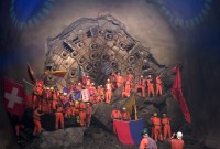 Image of sheet 20110323 photo 553: Miners celebrate after the tunnel drilling machine "Heidi" breaks through the last section of the Gotthard Base Tunnel West near Sedrun in the canton of Grisons, Switzerland, Wednesday, March 23, 2011.
..Die Mineure feiern nach dem 2. Hauptdurchschlag im Gotthardbasistunnel in Sedrun, vor der Tunnelbohrmaschine "Heidi" Mittwoch, 23. Maerz 2011. Wie geplant sind am Mittwoch die letzten Meter Fels im Gotthard-Basistunnel durchstossen worden. Rund fuenf Monate nach dem Durchschlag der Ostroehre ist damit auch die Westroehre zwischen Erstfeld und Bodio auf der gesamten Laenge von 57 Kilometern ausgebrochen. Kanton Graubünden √