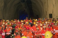 Image of sheet 20110323 photo 665: Miners celebrate after the tunnel drilling machine "Heidi" breaks through the last section of the Gotthard Base Tunnel West near Sedrun in the canton of Grisons, Switzerland, Wednesday, March 23, 2011.
..Die Mineure feiern nach dem 2. Hauptdurchschlag im Gotthardbasistunnel in Sedrun, vor der Tunnelbohrmaschine "Heidi" Mittwoch, 23. Maerz 2011. Wie geplant sind am Mittwoch die letzten Meter Fels im Gotthard-Basistunnel durchstossen worden. Rund fuenf Monate nach dem Durchschlag der Ostroehre ist damit auch die Westroehre zwischen Erstfeld und Bodio auf der gesamten Laenge von 57 Kilometern ausgebrochen. √