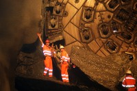 Image of sheet 20110323 photo 687: Miners celebrate after the tunnel drilling machine "Heidi" breaks through the last section of the Gotthard Base Tunnel West near Sedrun in the canton of Grisons, Switzerland, Wednesday, March 23, 2011. 
..Die Mineure feiern nach dem 2. Hauptdurchschlag (Durchstich Neat) im Gotthardbasistunnel in Sedrun, vor der Tunnelbohrmaschine "Heidi" Mittwoch, 23. Maerz 2011. Wie geplant sind am Mittwoch die letzten Meter Fels im Gotthard-Basistunnel durchstossen worden. damit ist auch die Westroehre zwischen Erstfeld und Bodio auf der gesamten Laenge von 57 Kilometern ausgebrochen. am Mittwoch, dem 23. März 2011, starteten die Mineure am längsten Eisenbahntunnel der Welt ein letztes Mal die Herrenknecht-Tunnelbohrmaschine »Heidi« (Gripper-TBM, Durchmesser 9,43 m). Nach insgesamt 25,2 km fiel um 12:20 Uhr die Felswand beim Durchbruch. Damit ist der Weg durch die Alpen durchgängig frei.
Tessiner Ingenieur Giovanni Lombardi
Renzo Simoni, Chief Executive Officer AlpTransit Gotthard, celebrate with Product Manager Jens Classen (in a old tunel worker uniform) after the tunnel drilling machine "Heidi" broke through the last section of the Gotthard Base Tunnel near Sedrun in the canton of Grisons, Switzerland. With 57 kilometre (35-mile) the new St. Gotthard tunnel is the world's longest tunnel. The 13,157 billion Swiss franc (9,6 billion euros, 13,6 billion dollars) Alptransit project, which is due to be operational in 2016, constitutes the center piece of the New Railway Link through the Alps NRLA. √