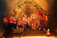 Image of sheet 20110323 photo 695: Miners celebrate after the tunnel drilling machine "Heidi" breaks through the last section of the Gotthard Base Tunnel West near Sedrun in the canton of Grisons, Switzerland, Wednesday, March 23, 2011. 
..Die Mineure feiern nach dem 2. Hauptdurchschlag (Durchstich Neat) im Gotthardbasistunnel in Sedrun, vor der Tunnelbohrmaschine "Heidi" Mittwoch, 23. Maerz 2011. Wie geplant sind am Mittwoch die letzten Meter Fels im Gotthard-Basistunnel durchstossen worden. damit ist auch die Westroehre zwischen Erstfeld und Bodio auf der gesamten Laenge von 57 Kilometern ausgebrochen. am Mittwoch, dem 23. März 2011, starteten die Mineure am längsten Eisenbahntunnel der Welt ein letztes Mal die Herrenknecht-Tunnelbohrmaschine »Heidi« (Gripper-TBM, Durchmesser 9,43 m). Nach insgesamt 25,2 km fiel um 12:20 Uhr die Felswand beim Durchbruch. Damit ist der Weg durch die Alpen durchgängig frei.
Tessiner Ingenieur Giovanni Lombardi
Renzo Simoni, Chief Executive Officer AlpTransit Gotthard, celebrate with Product Manager Jens Classen (in a old tunel worker uniform) after the tunnel drilling machine "Heidi" broke through the last section of the Gotthard Base Tunnel near Sedrun in the canton of Grisons, Switzerland. With 57 kilometre (35-mile) the new St. Gotthard tunnel is the world's longest tunnel. The 13,157 billion Swiss franc (9,6 billion euros, 13,6 billion dollars) Alptransit project, which is due to be operational in 2016, constitutes the center piece of the New Railway Link through the Alps NRLA. √