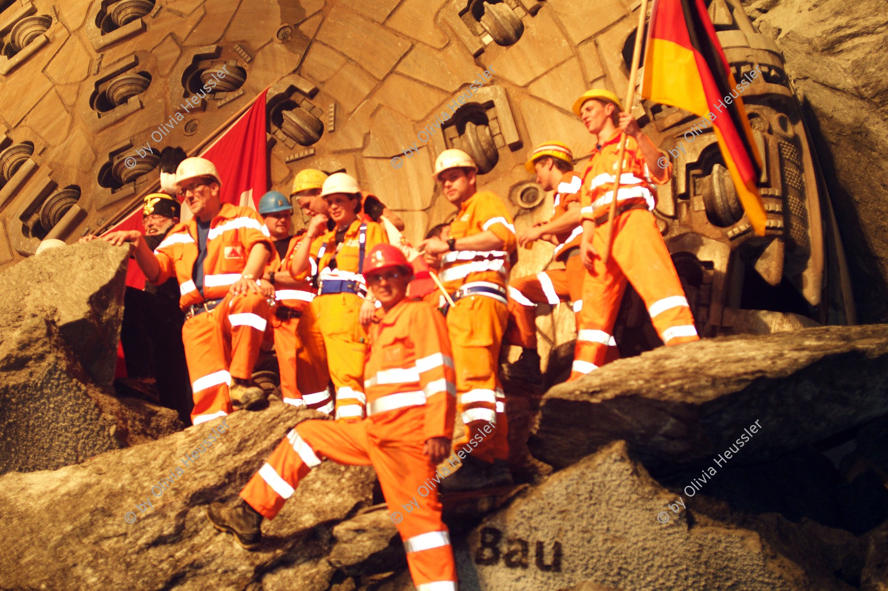 Image of sheet 20110323 photo 703: Miners celebrate after the tunnel drilling machine "Heidi" breaks through the last section of the Gotthard Base Tunnel West near Sedrun in the canton of Grisons, Switzerland, Wednesday, March 23, 2011. 
..Die Mineure feiern nach dem 2. Hauptdurchschlag (Durchstich Neat) im Gotthardbasistunnel in Sedrun, vor der Tunnelbohrmaschine "Heidi" Mittwoch, 23. Maerz 2011. Wie geplant sind am Mittwoch die letzten Meter Fels im Gotthard-Basistunnel durchstossen worden. damit ist auch die Westroehre zwischen Erstfeld und Bodio auf der gesamten Laenge von 57 Kilometern ausgebrochen. am Mittwoch, dem 23. März 2011, starteten die Mineure am längsten Eisenbahntunnel der Welt ein letztes Mal die Herrenknecht-Tunnelbohrmaschine »Heidi« (Gripper-TBM, Durchmesser 9,43 m). Nach insgesamt 25,2 km fiel um 12:20 Uhr die Felswand beim Durchbruch. Damit ist der Weg durch die Alpen durchgängig frei.
Tessiner Ingenieur Giovanni Lombardi
Renzo Simoni, Chief Executive Officer AlpTransit Gotthard, celebrate with Product Manager Jens Classen (in a old tunel worker uniform) after the tunnel drilling machine "Heidi" broke through the last section of the Gotthard Base Tunnel near Sedrun in the canton of Grisons, Switzerland. With 57 kilometre (35-mile) the new St. Gotthard tunnel is the world's longest tunnel. The 13,157 billion Swiss franc (9,6 billion euros, 13,6 billion dollars) Alptransit project, which is due to be operational in 2016, constitutes the center piece of the New Railway Link through the Alps NRLA. √