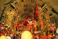 Image of sheet 20110323 photo 717: Miners celebrate after the tunnel drilling machine "Heidi" breaks through the last section of the Gotthard Base Tunnel West near Sedrun in the canton of Grisons, Switzerland, Wednesday, March 23, 2011
..Die Mineure feiern nach dem 2. Hauptdurchschlag (Durchstich Neat) im Gotthardbasistunnel in Sedrun, vor der Tunnelbohrmaschine "Heidi" Mittwoch, 23. Maerz 2011. Wie geplant sind am Mittwoch die letzten Meter Fels im Gotthard-Basistunnel durchstossen worden. damit ist auch die Westroehre zwischen Erstfeld und Bodio auf der gesamten Laenge von 57 Kilometern ausgebrochen. am Mittwoch, dem 23. März 2011, starteten die Mineure am längsten Eisenbahntunnel der Welt ein letztes Mal die Herrenknecht-Tunnelbohrmaschine »Heidi« (Gripper-TBM, Durchmesser 9,43 m). Nach insgesamt 25,2 km fiel um 12:20 Uhr die Felswand beim Durchbruch. Damit ist der Weg durch die Alpen durchgängig frei.
Tessiner Ingenieur Giovanni Lombardi
Renzo Simoni, Chief Executive Officer AlpTransit Gotthard, celebrate with Product Manager Jens Classen (in a old tunel worker uniform) after the tunnel drilling machine "Heidi" broke through the last section of the Gotthard Base Tunnel near Sedrun in the canton of Grisons, Switzerland. With 57 kilometre (35-mile) the new St. Gotthard tunnel is the world's longest tunnel. The 13,157 billion Swiss franc (9,6 billion euros, 13,6 billion dollars) Alptransit project, which is due to be operational in 2016, constitutes the center piece of the New Railway Link through the Alps NRLA √