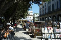 Image of sheet 20140217 photo 41: Tourist mit Hut sitzt im Park während dem Markt Buchmarkt in der Altstadt Habana, Cuba, Havanna Kuba Zentral Amerika 2014
central america