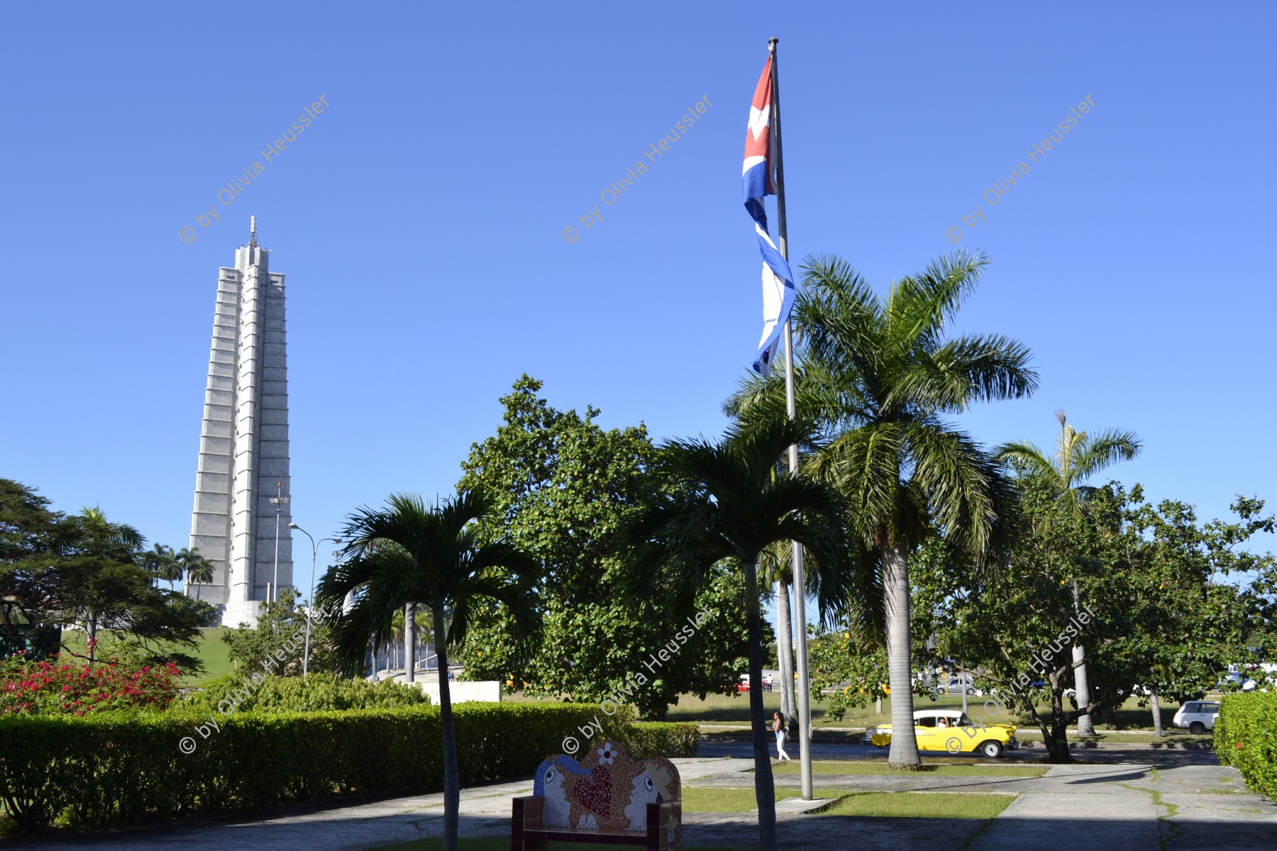 Image of sheet 20140219 photo 62: Das Denkmal für José Marti mit der kubanischen Flagge im Vordergrund und gelben Oldtimer in Havanna beim Revolutionsplatz Plaza de la Revolution La Habana Cuba 2014